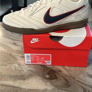 Nike White Sneakers with Blue and Red Accents